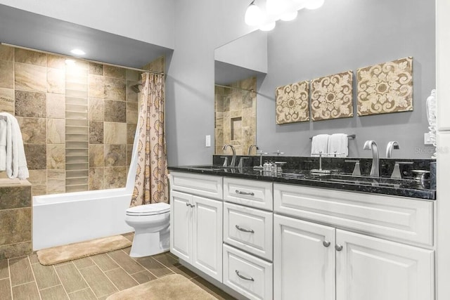 full bathroom featuring vanity, toilet, and shower / bath combo with shower curtain