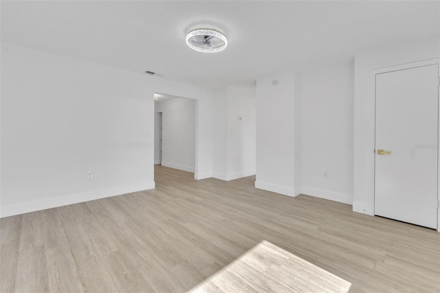 spare room featuring light hardwood / wood-style floors