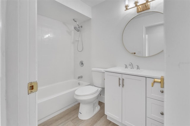 full bathroom with hardwood / wood-style flooring, vanity, toilet, and shower / tub combination