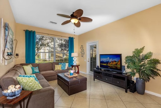 tiled living room with ceiling fan