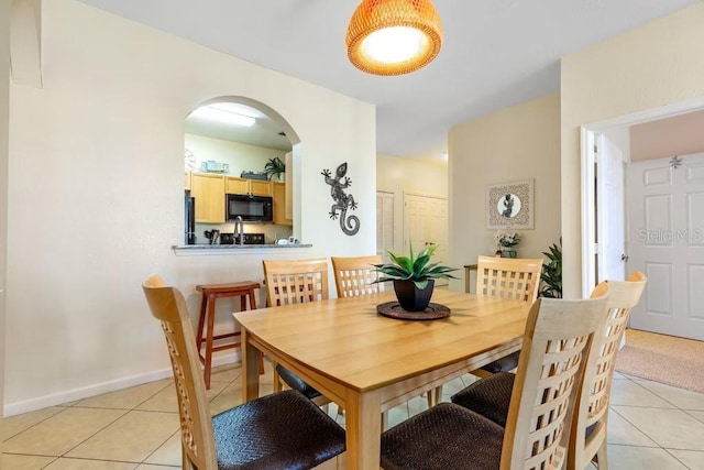 dining room with light tile patterned flooring