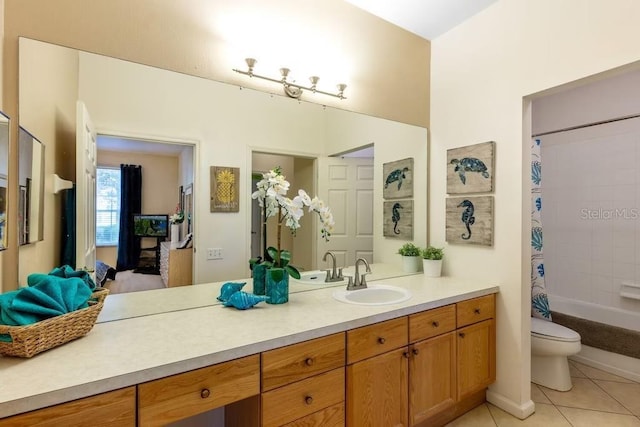 full bathroom with tile patterned floors, vanity, toilet, and shower / tub combo with curtain