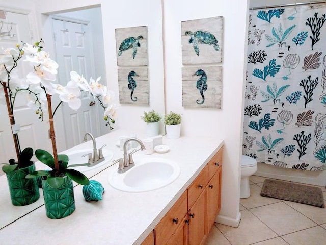 bathroom with tile patterned floors, vanity, toilet, and a shower with shower curtain