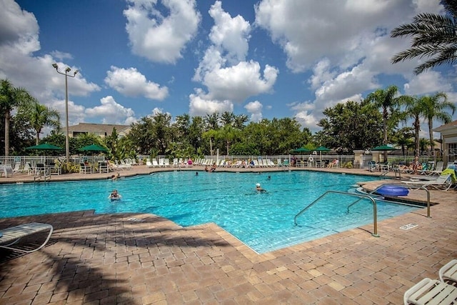 view of swimming pool with a patio area