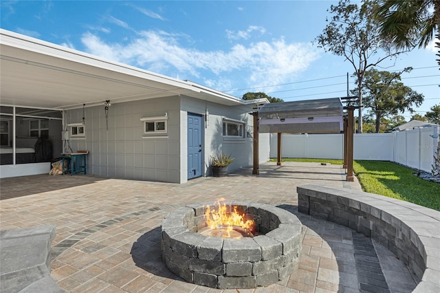 view of patio / terrace with a fire pit