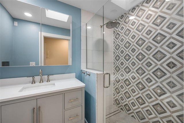 bathroom with vanity and walk in shower