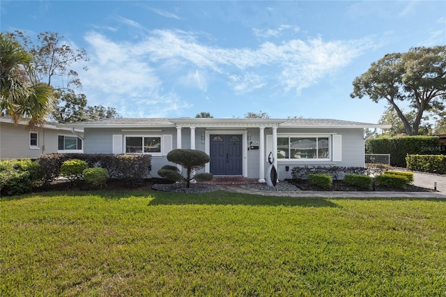 single story home featuring a front yard