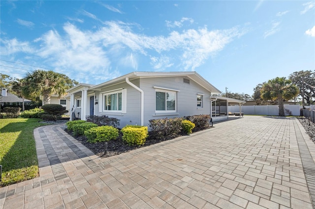 view of home's exterior featuring a carport