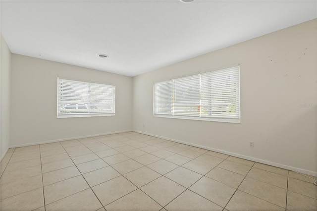 empty room featuring light tile patterned floors