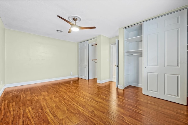 unfurnished bedroom with hardwood / wood-style floors and ceiling fan