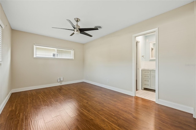 spare room with ceiling fan and wood-type flooring