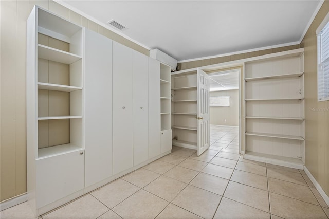 spacious closet featuring light tile patterned floors