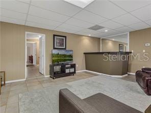 living room featuring light tile patterned flooring