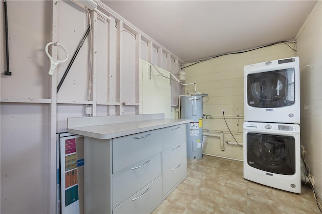 laundry area featuring crown molding, stacked washer / dryer, beverage cooler, and water heater