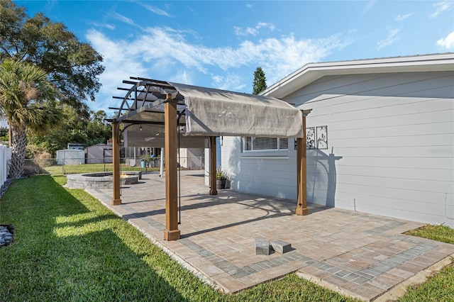 view of patio with a pergola and an outdoor fire pit