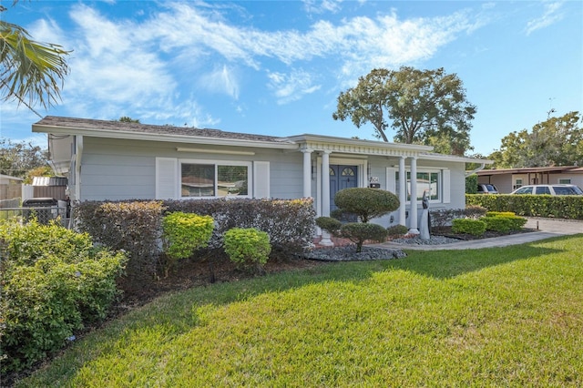 ranch-style home with a front yard