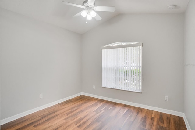 unfurnished room with hardwood / wood-style floors, vaulted ceiling, and ceiling fan