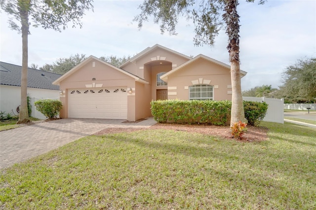 view of front facade featuring a garage and a front lawn