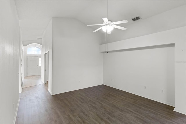 unfurnished room featuring ceiling fan, dark wood-type flooring, and high vaulted ceiling