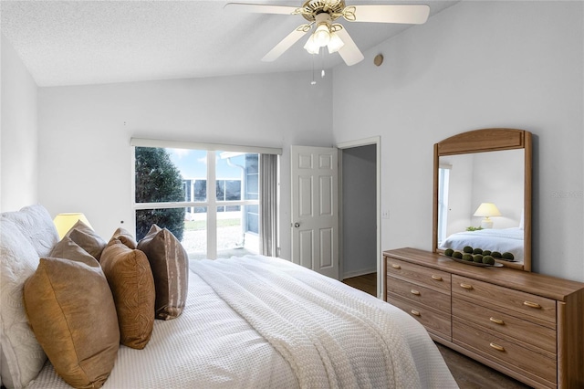 bedroom featuring ceiling fan, lofted ceiling, and a textured ceiling