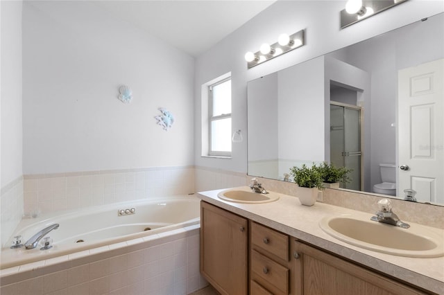 full bathroom featuring plus walk in shower, vanity, and toilet