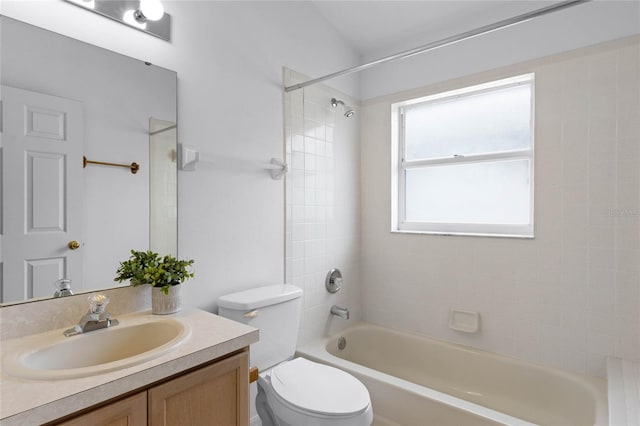 full bathroom with vanity, toilet, and tiled shower / bath