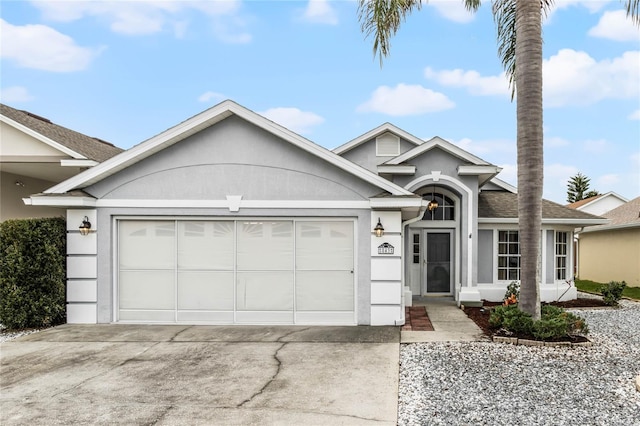 ranch-style home featuring a garage