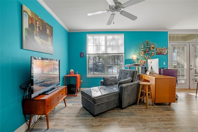 sitting room with crown molding, french doors, ceiling fan, and hardwood / wood-style flooring