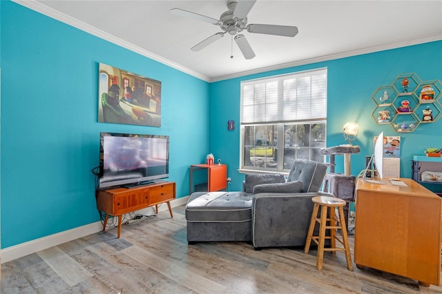 sitting room featuring ceiling fan, ornamental molding, and hardwood / wood-style flooring