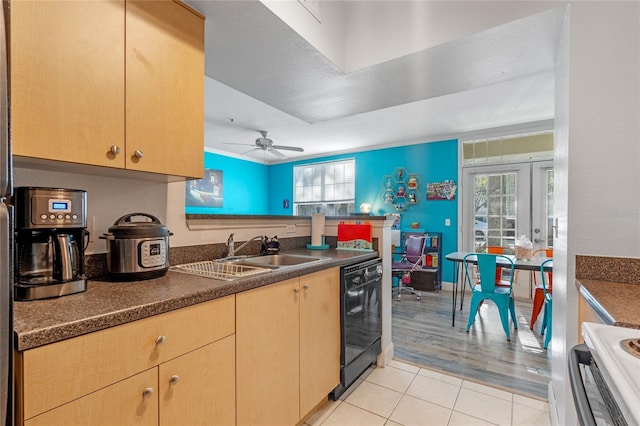 kitchen with ceiling fan, sink, black dishwasher, stove, and light tile patterned floors