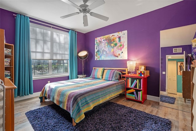 bedroom featuring ceiling fan and light wood-type flooring