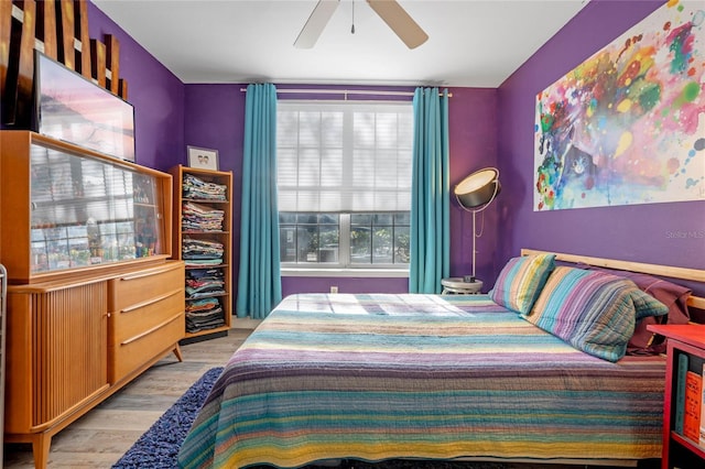 bedroom with ceiling fan and light wood-type flooring