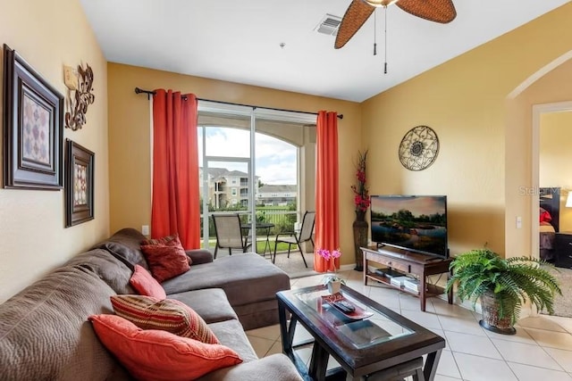 living room with ceiling fan and light tile patterned flooring