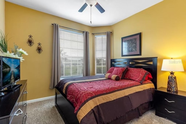 bedroom with ceiling fan and carpet floors