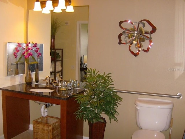 bathroom featuring toilet and sink