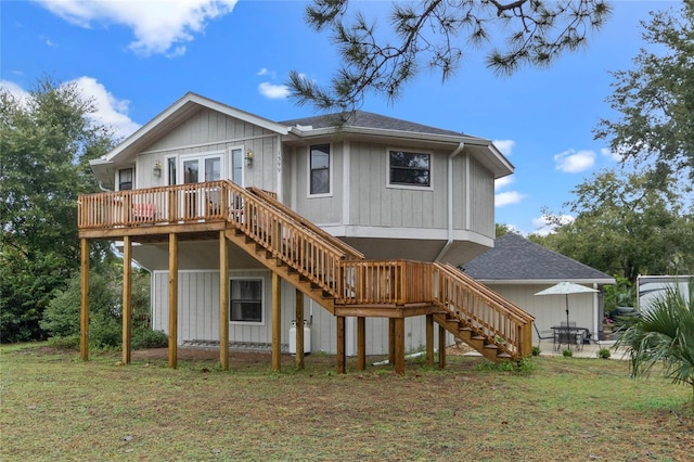 back of house with a patio area, a yard, and a deck