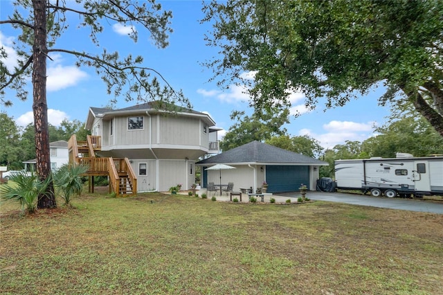 back of property with a patio and a lawn