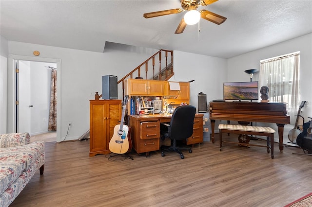 office with wood-type flooring, a textured ceiling, and ceiling fan