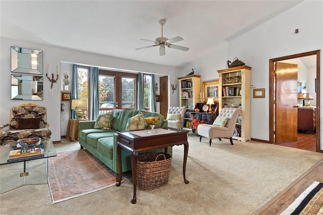 living room with french doors, ceiling fan, lofted ceiling, and hardwood / wood-style floors