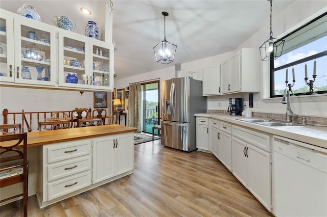 kitchen featuring dishwasher, stainless steel fridge with ice dispenser, and white cabinetry