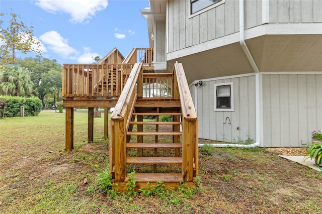 view of jungle gym with a yard and a wooden deck