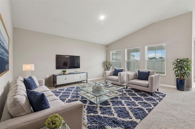 carpeted living room with lofted ceiling