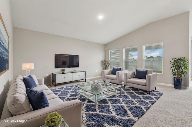 carpeted living room featuring vaulted ceiling