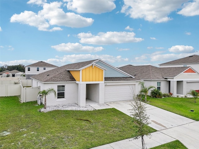 view of front facade with a garage and a front lawn