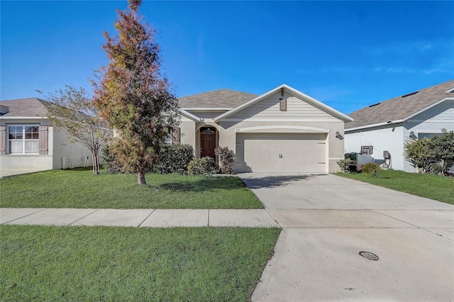 ranch-style house with a front lawn and a garage