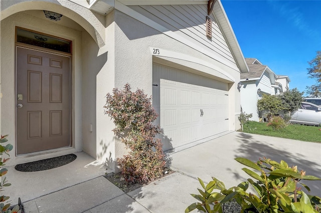 property entrance with a garage