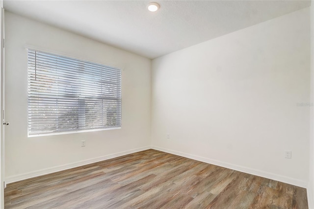 unfurnished room featuring light wood-type flooring