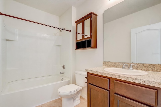 full bathroom featuring washtub / shower combination, tile patterned floors, vanity, and toilet