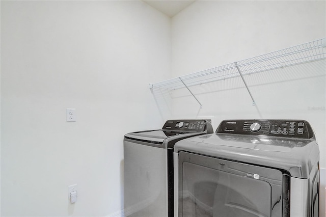 clothes washing area with independent washer and dryer