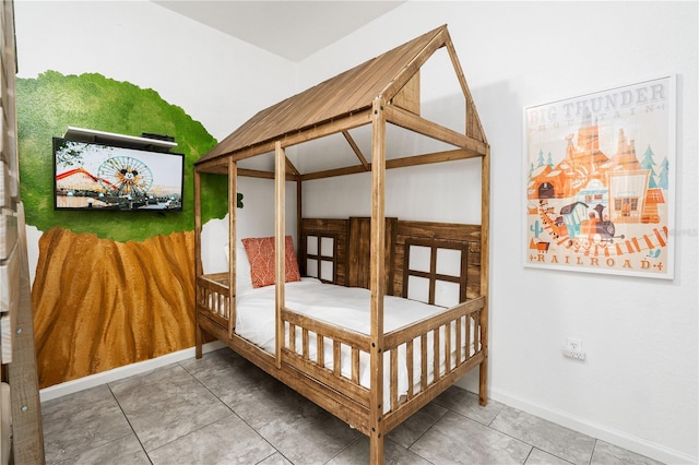 bedroom featuring tile patterned floors and a closet